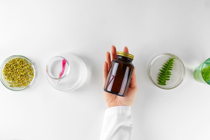making-herbal-dietary-supplement-in-lab-with-plant-leaves-health-and-beauty-concept (1)