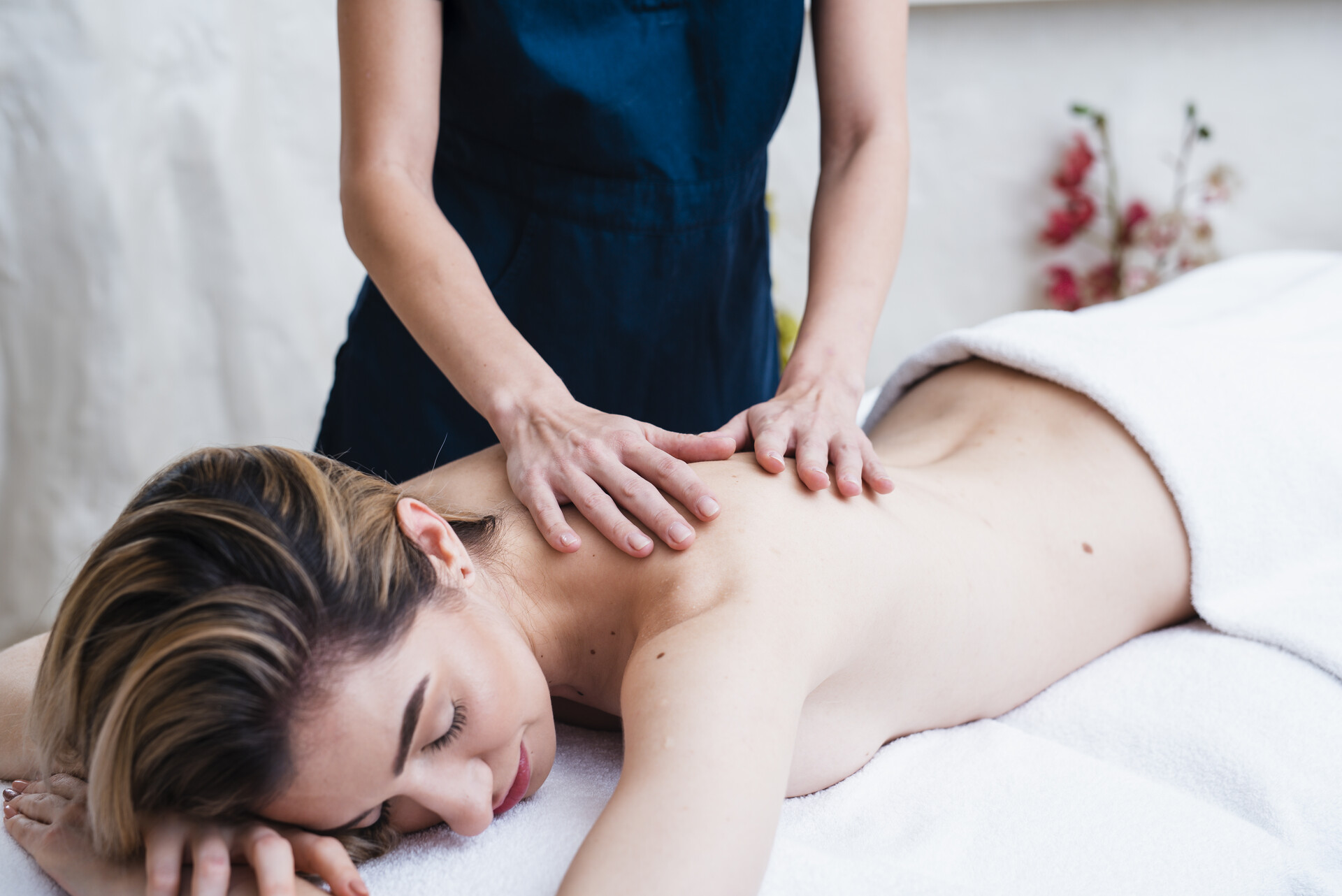 relaxed-woman-enjoying-a-back-massage